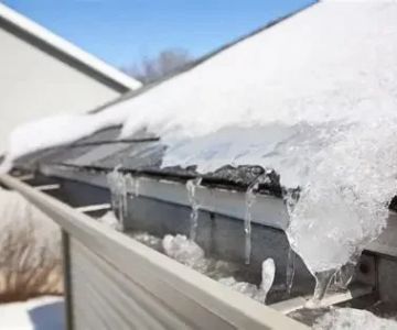 How to Deal With Water Damage From Roof Ice Dams: Prevention and Repair Tips